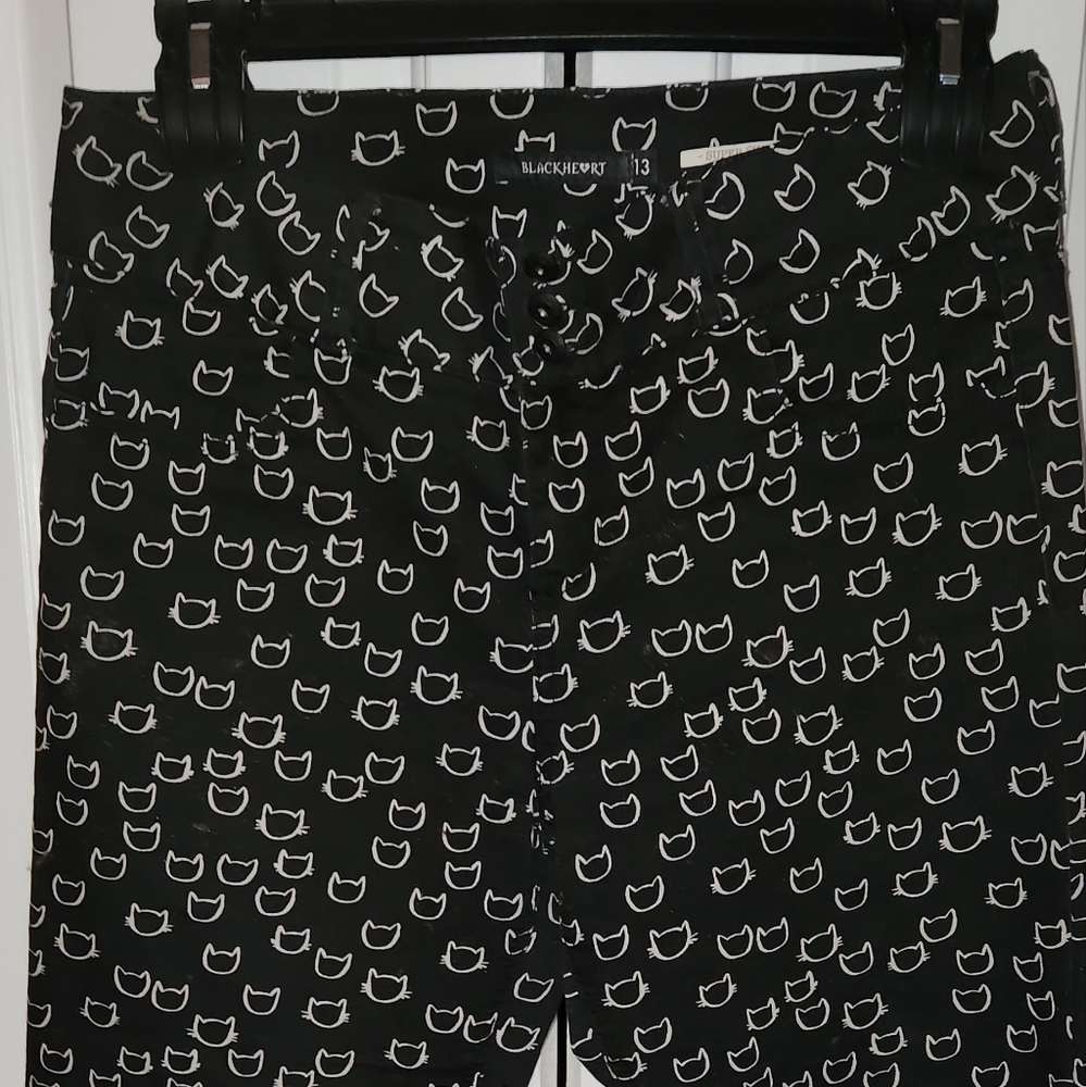 Black cat printed skinny jeans.